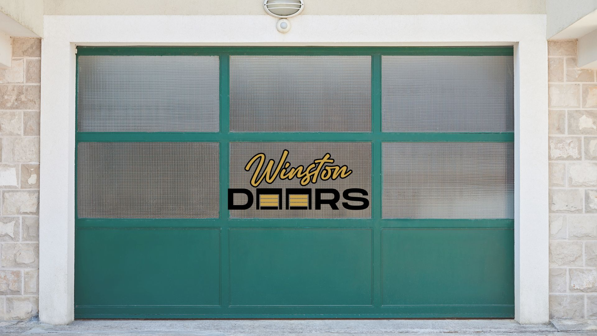 a green glass garage door with two windows on the side of the building
